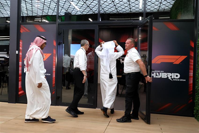 Arabian men walking into Paddock club